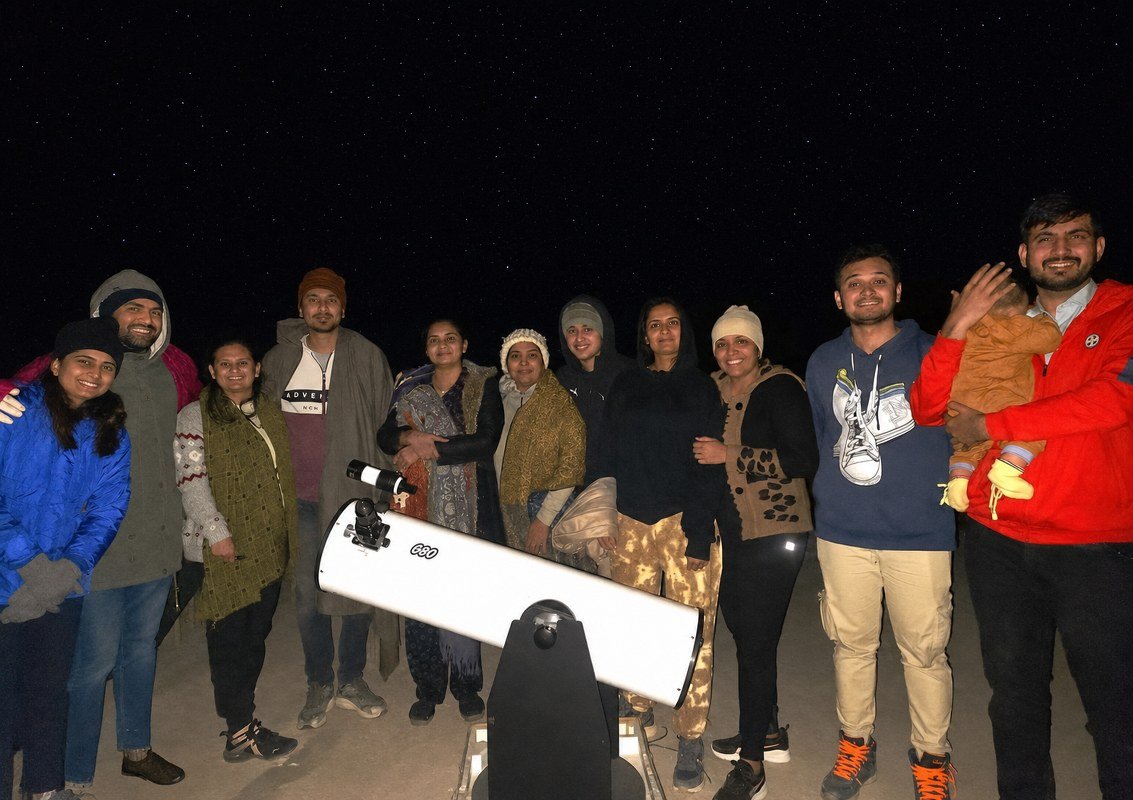 Group enjoying stargazing in Jaisalmer desert